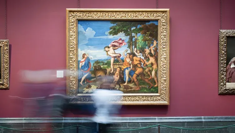 People looking at a painting at the National Gallery in London