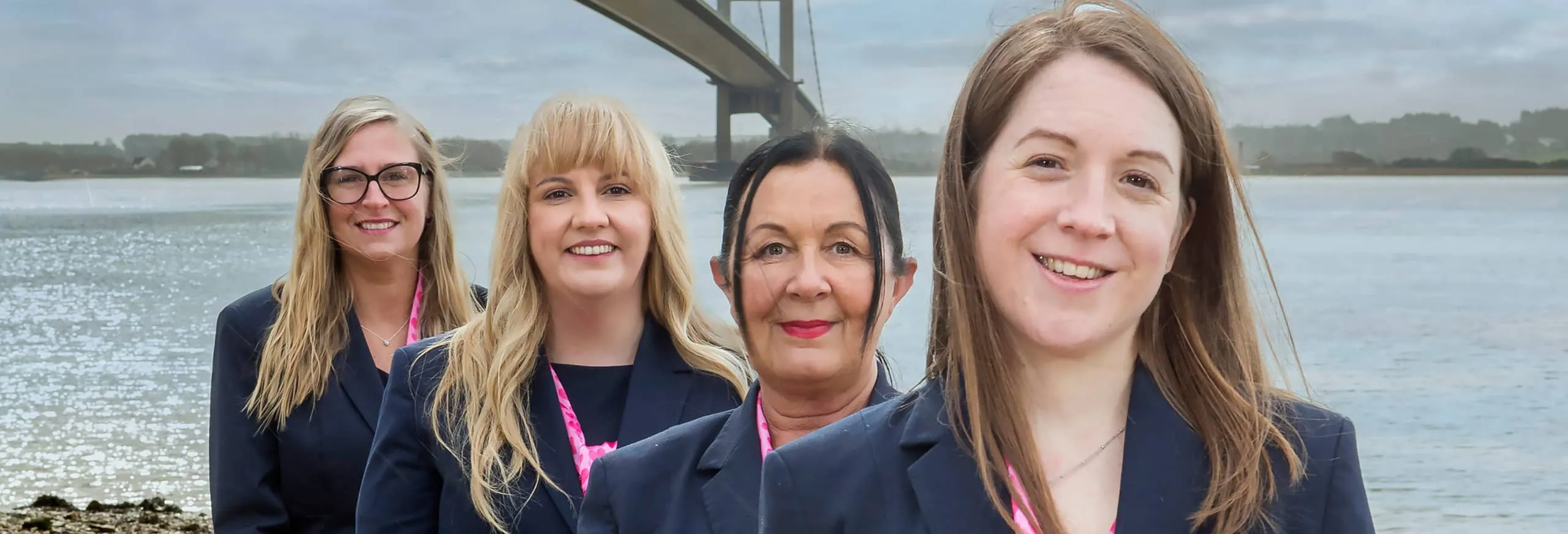 A photo of Hull Trains colleagues in front of the Humber Bridge