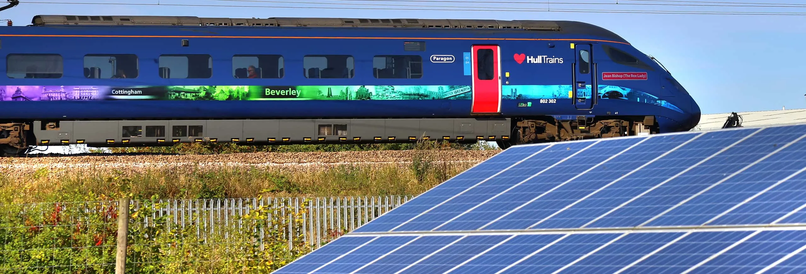 A Hull Trains service passing solar panels on route
