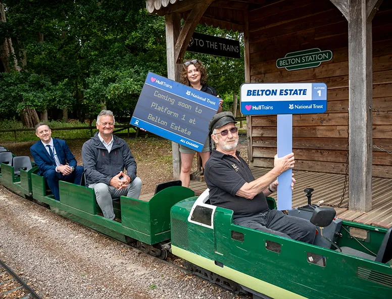 A group of people at Belton Estate on a miniature train