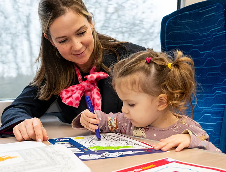 A family travelling onboard a Hull Trains service with kids packs